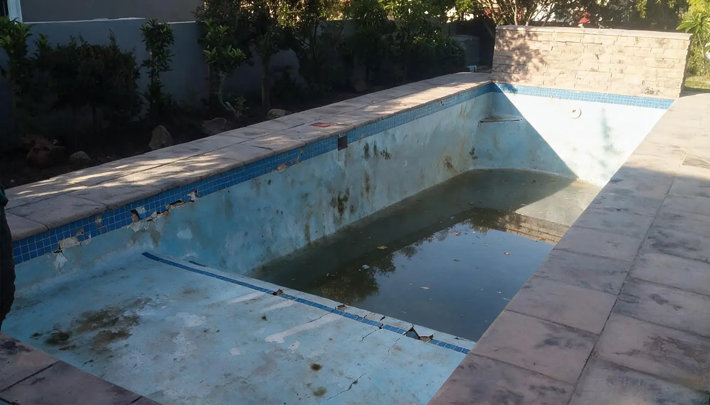 Ageing Marbelite swimming pool before renovation