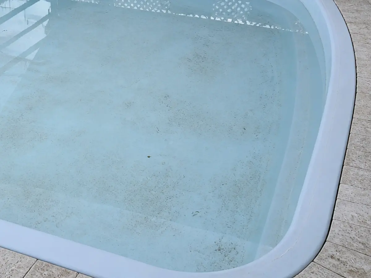 Faded fibreglass swimming pool surface