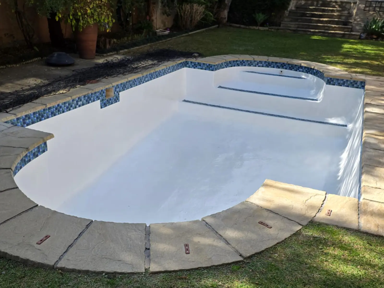 Fibreglass swimming pool after professional repair and refinishing