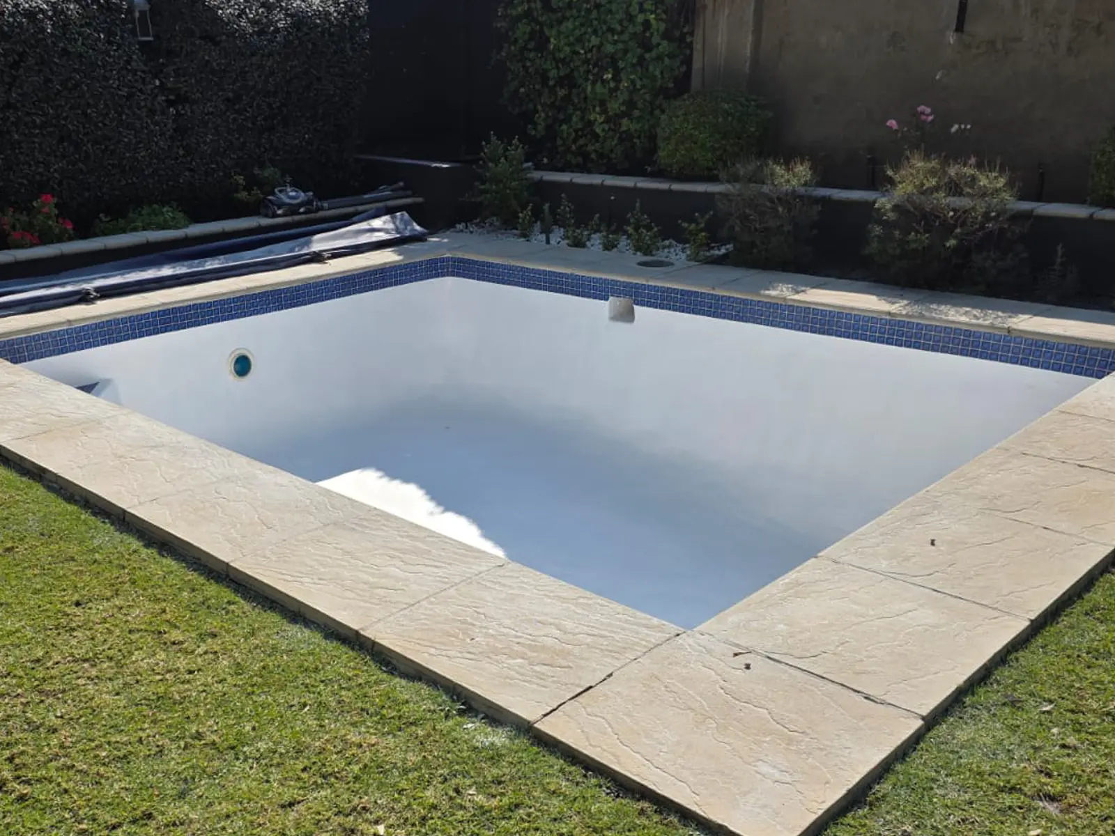 Bright blue fibreglass pool after complete repair and restoration