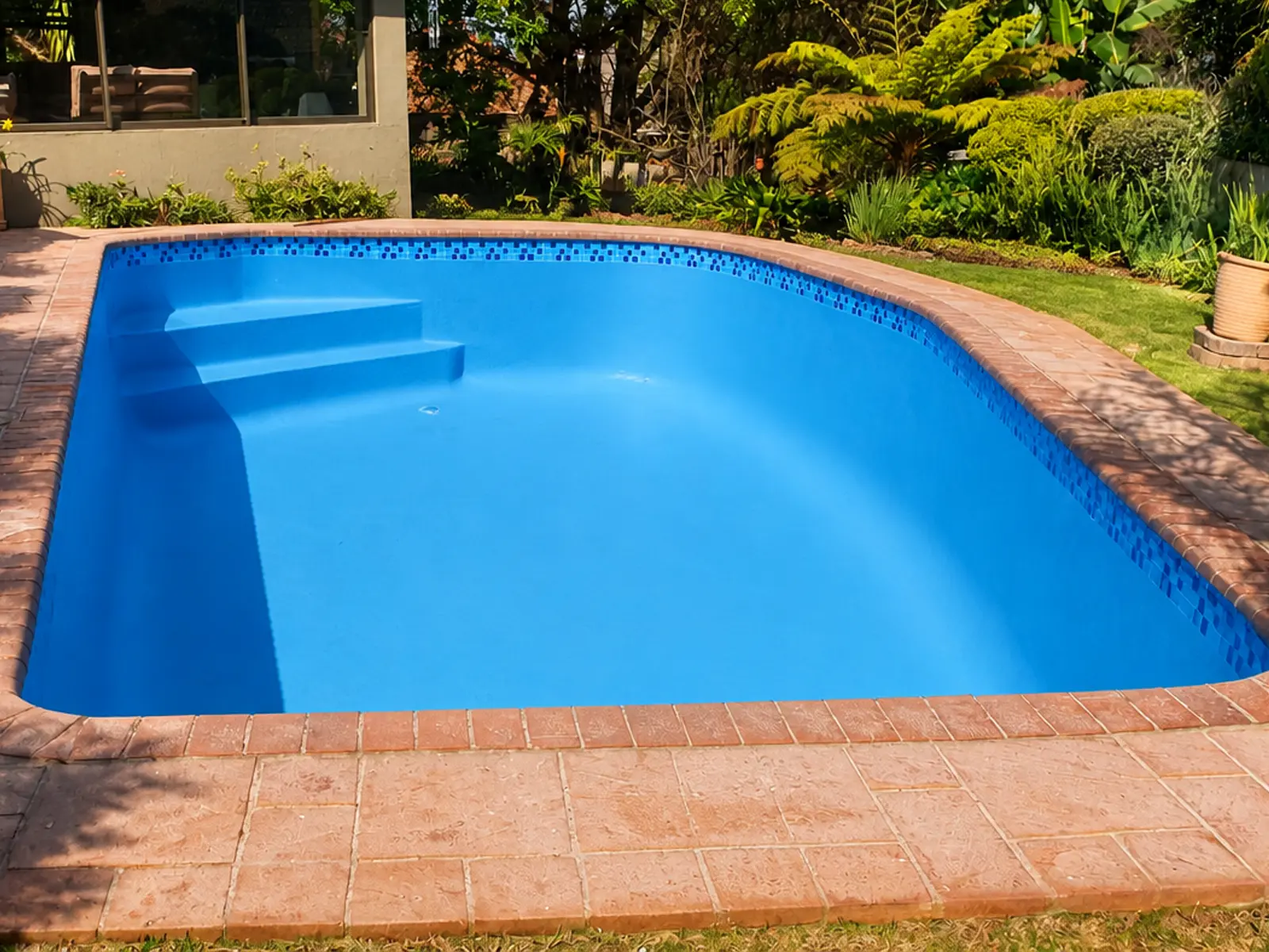 Fibreglass pool after professional repair and white refinishing