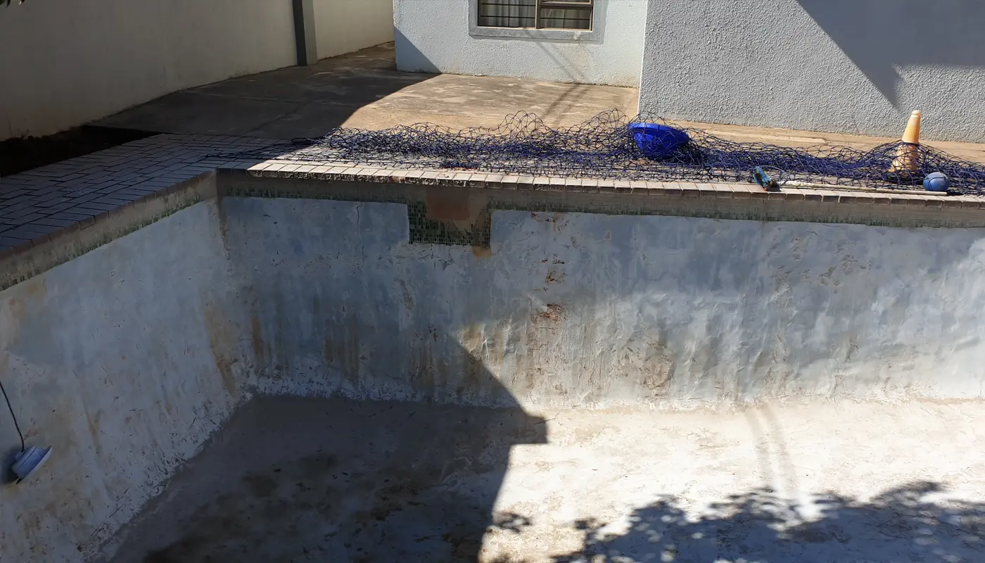 Marbelite pool drained and prepared for renovation