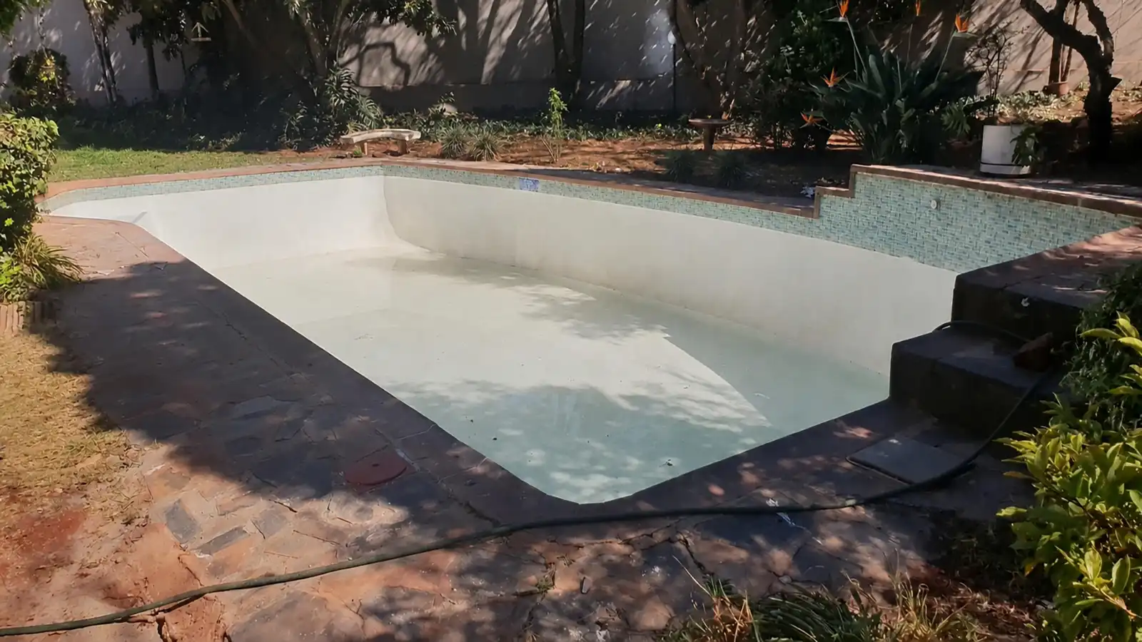 Old swimming pool before resurfacing and renovation
