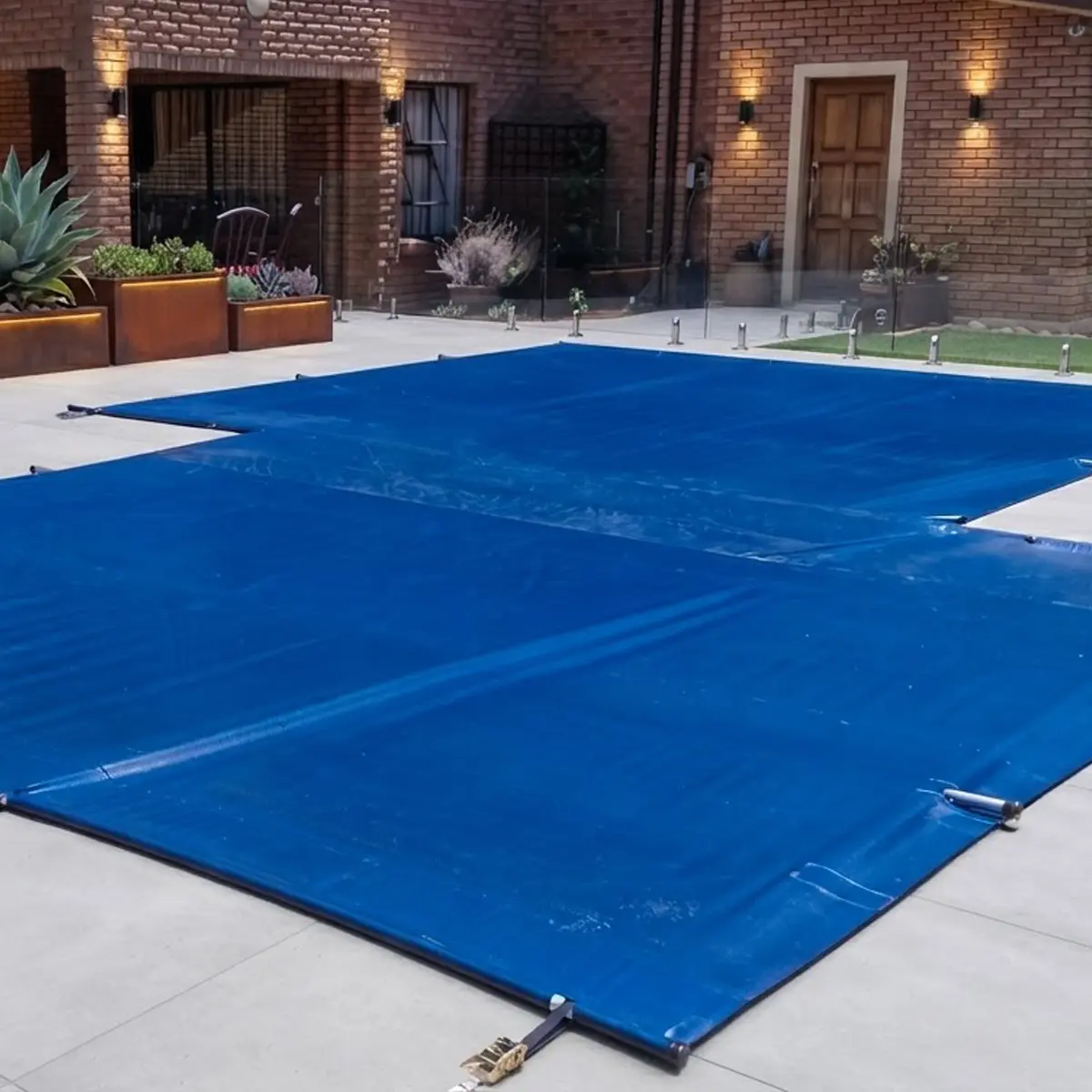 Solid safety pool cover fitted over a residential swimming pool